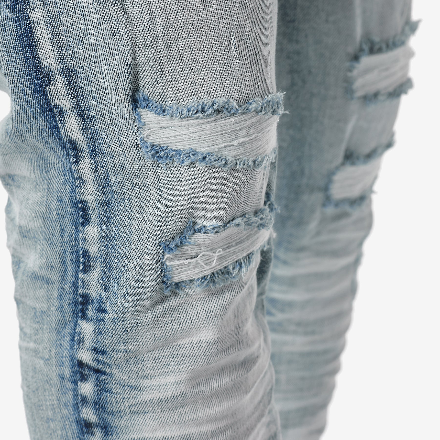 LIGHT TINT BLUE JEANS WITH RIP & REPAIR