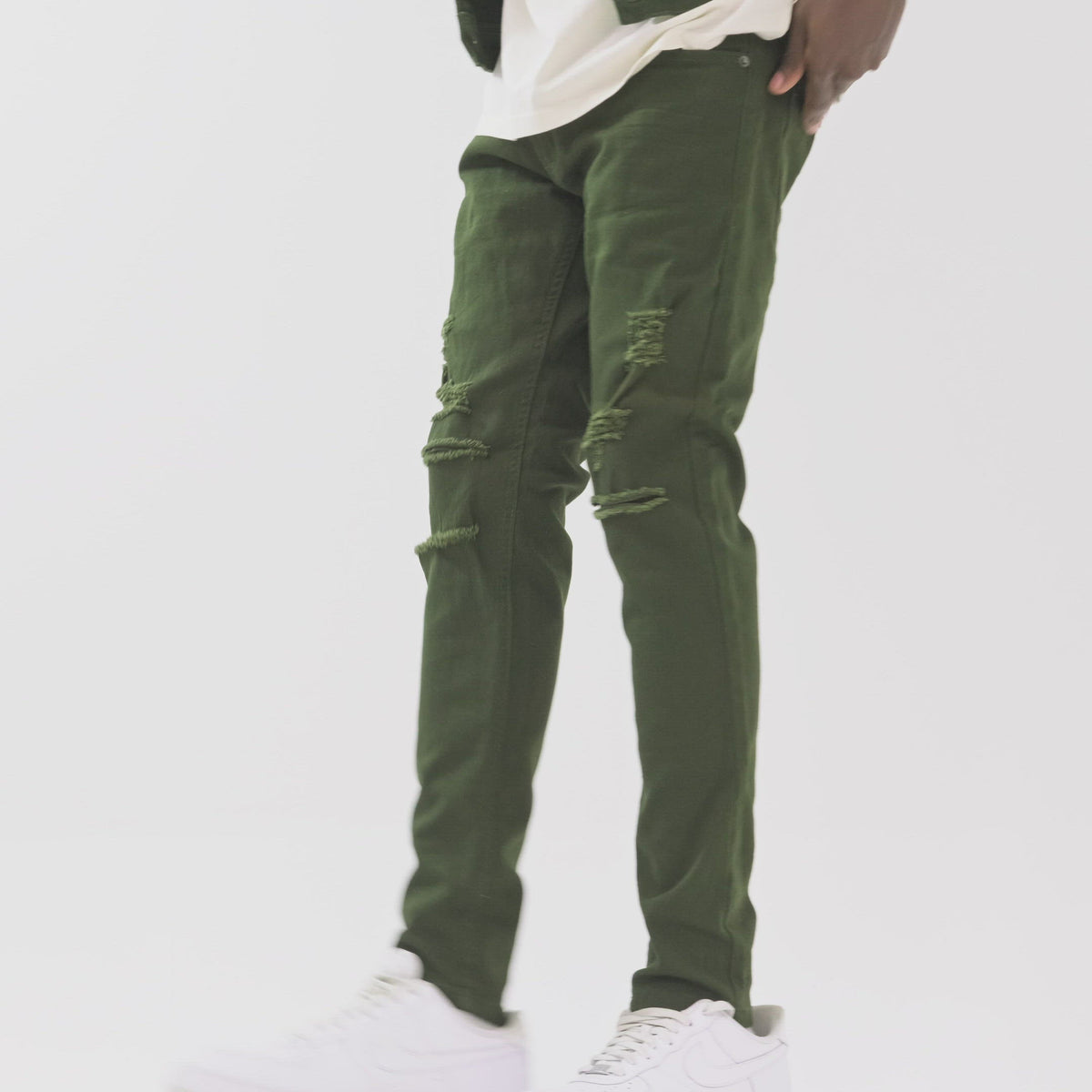 OLIVE PANTS WITH RIPS