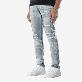LIGHT TINT BLUE JEANS WITH RIP & REPAIR