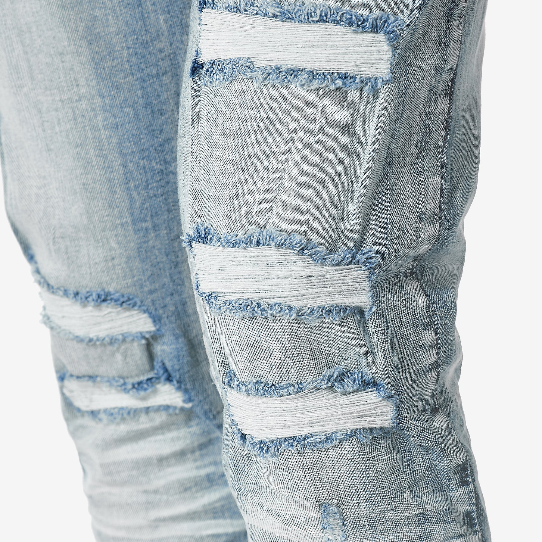 LIGHT TINT BLUE JEANS WITH RIP & REPAIR